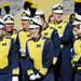 Members of the Michigan marching band stand together as they wait to record vocals for a Pure Michigan video shoot at Michigan Stadium on Wednesday. Melanie Maxwell I AnnArbor.com